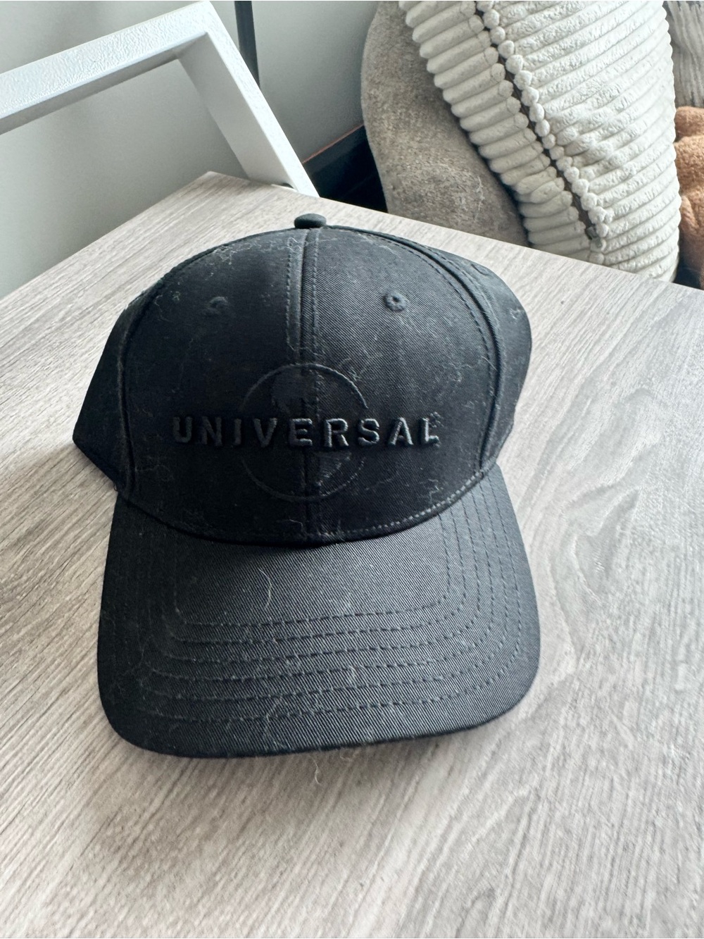 Universal Black Embossed Logo Baseball Cap